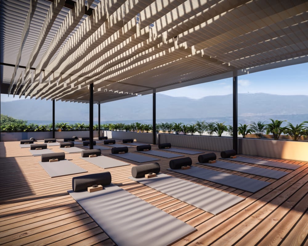 a large room with a large glass roof and a view of the ocean