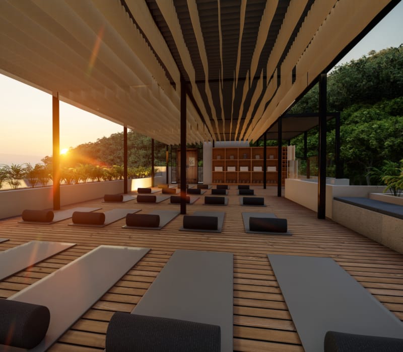 a large room with a pool and lounge chairs