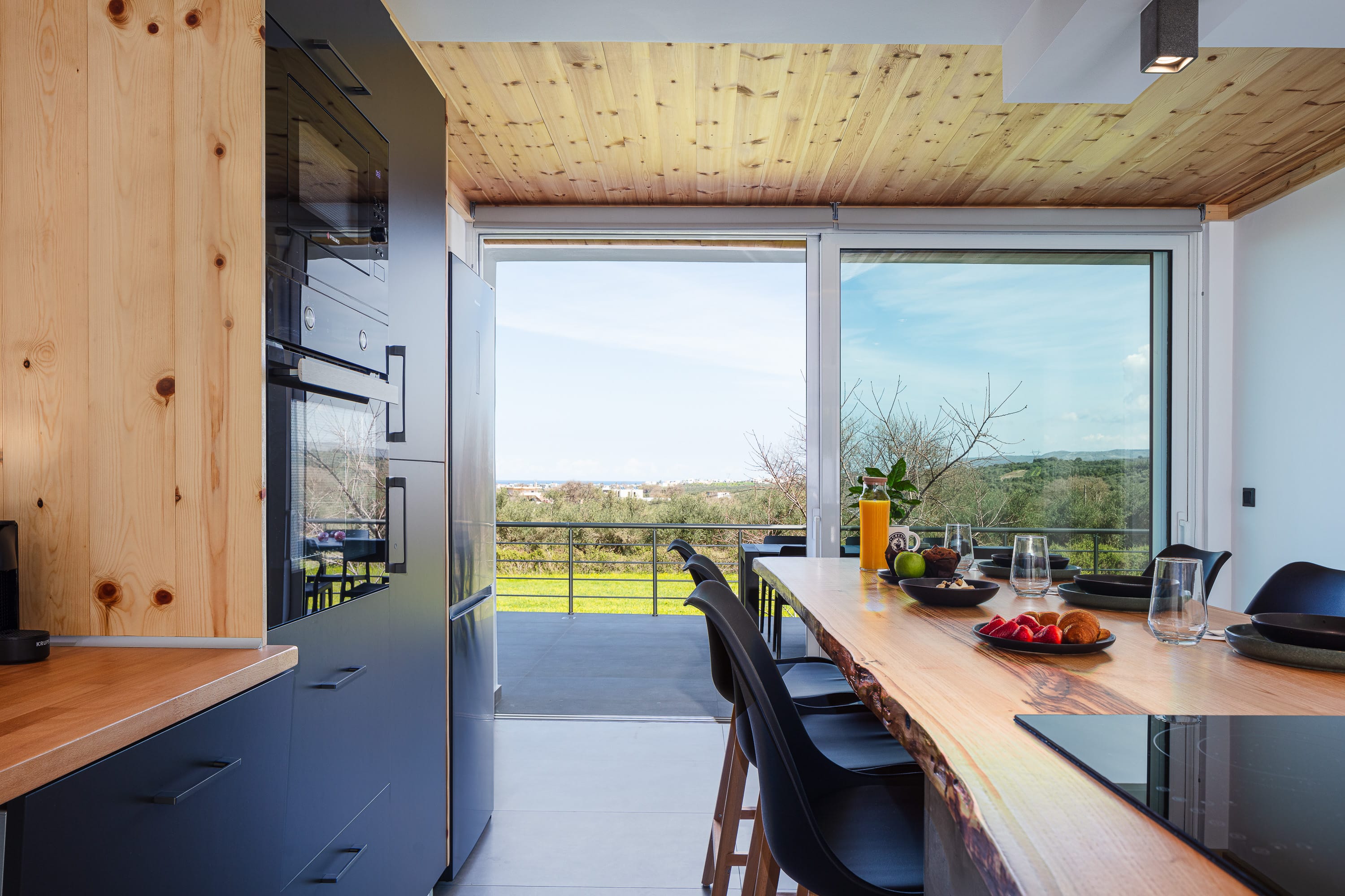 a kitchen with a table and chairs