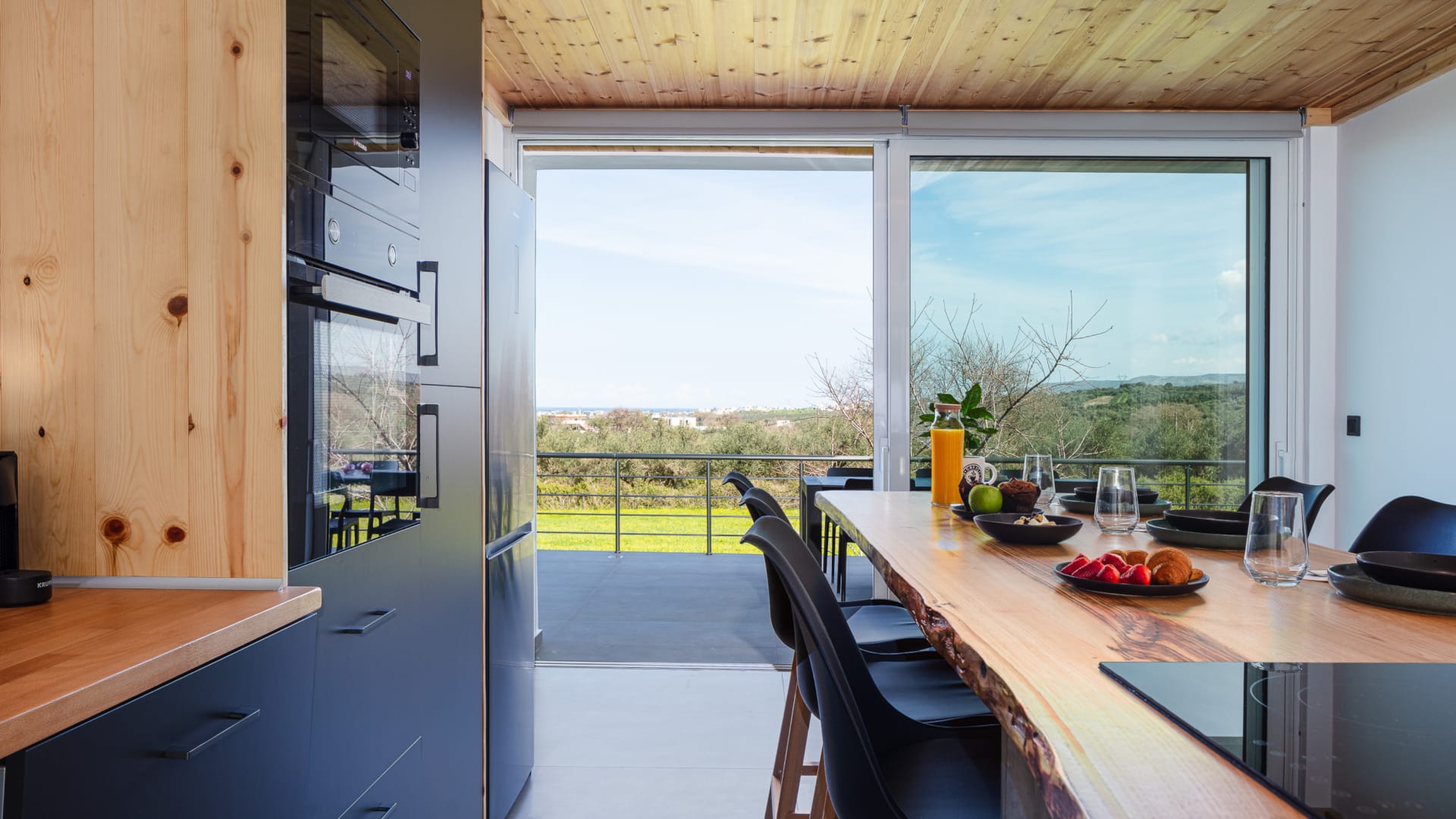 a kitchen with a table and chairs