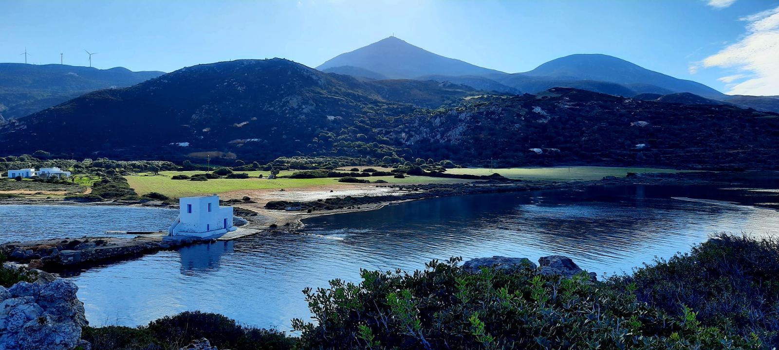 a lake with mountains in the background