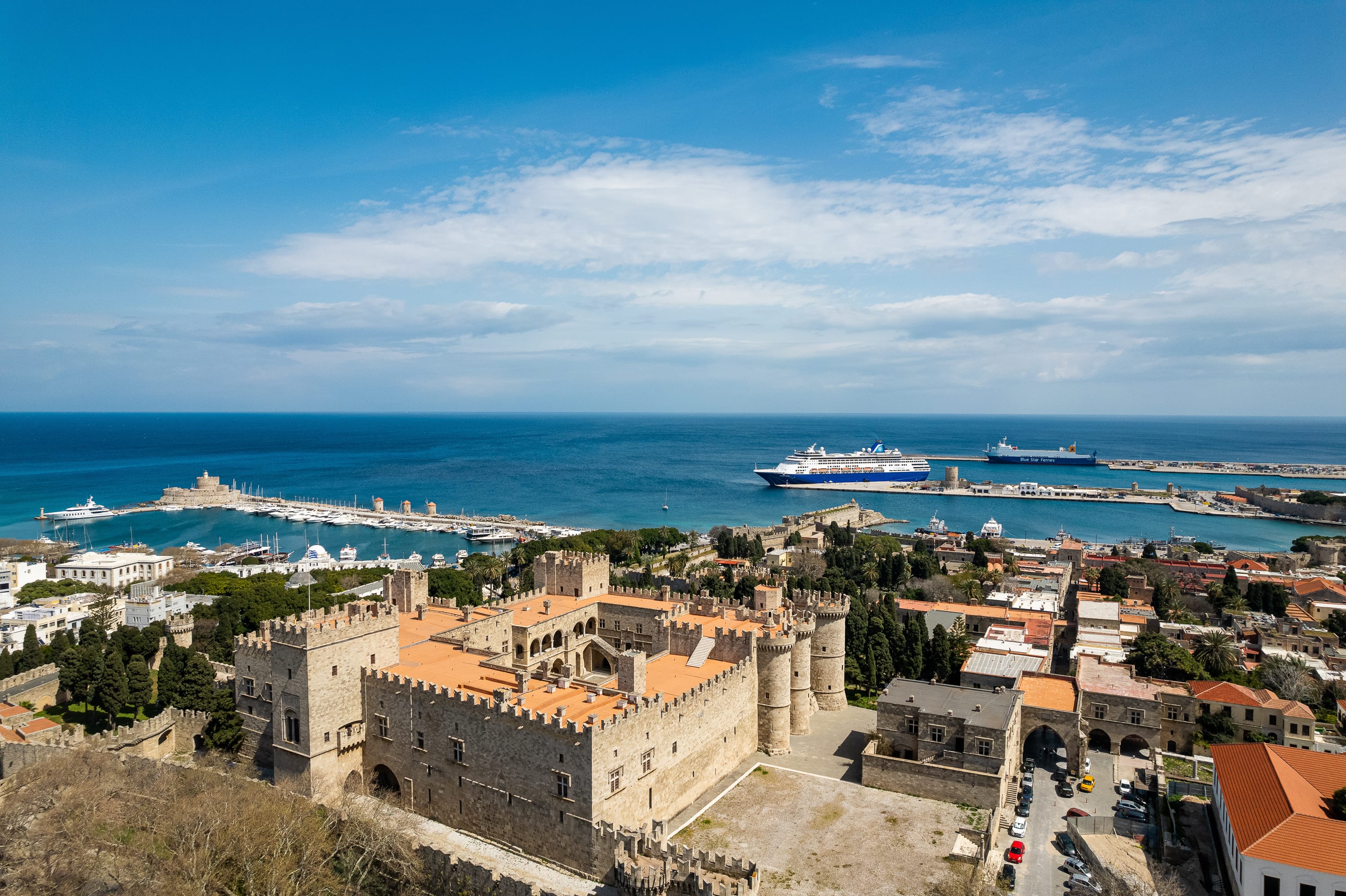 a city with a body of water in the background