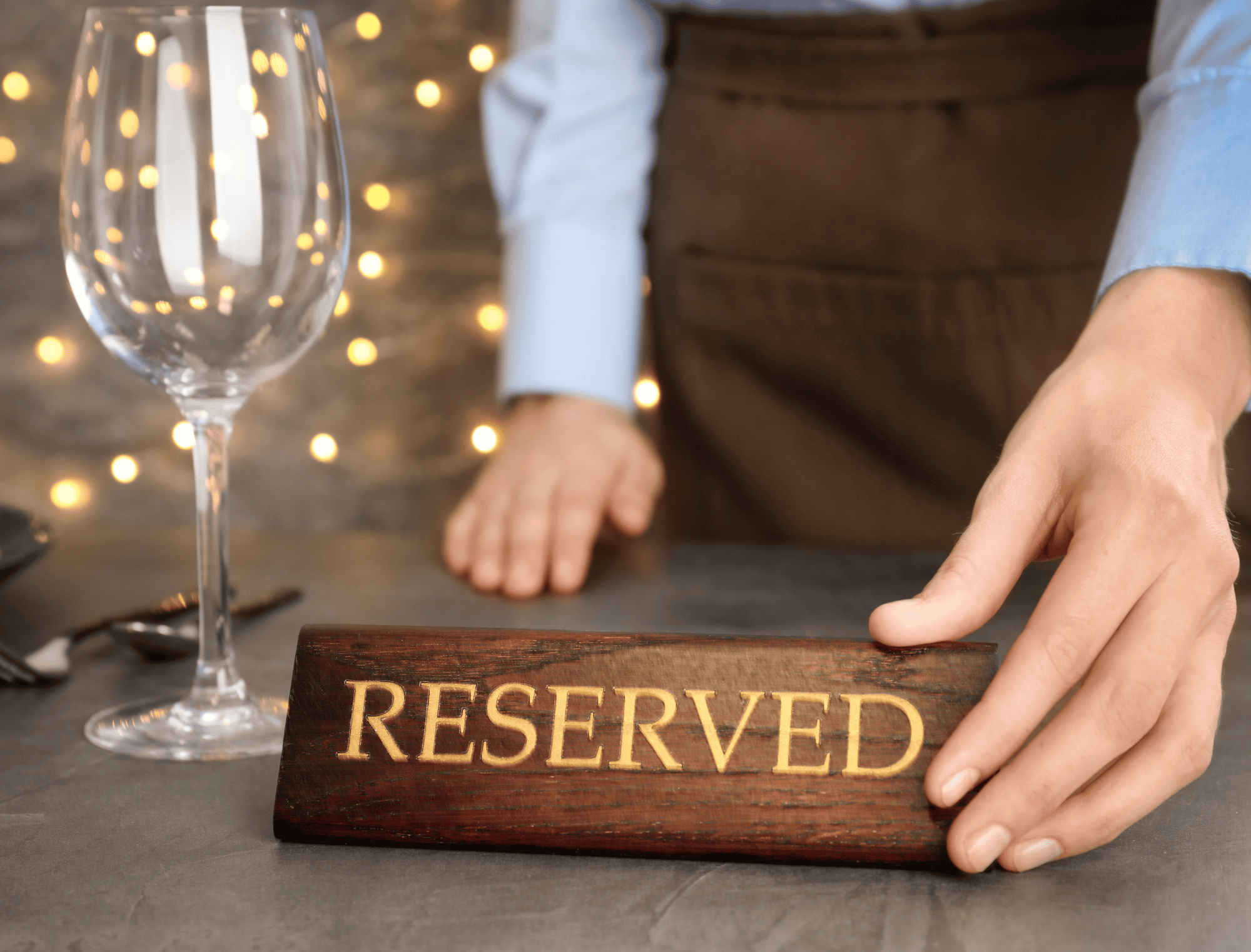 a person holding a wine glass