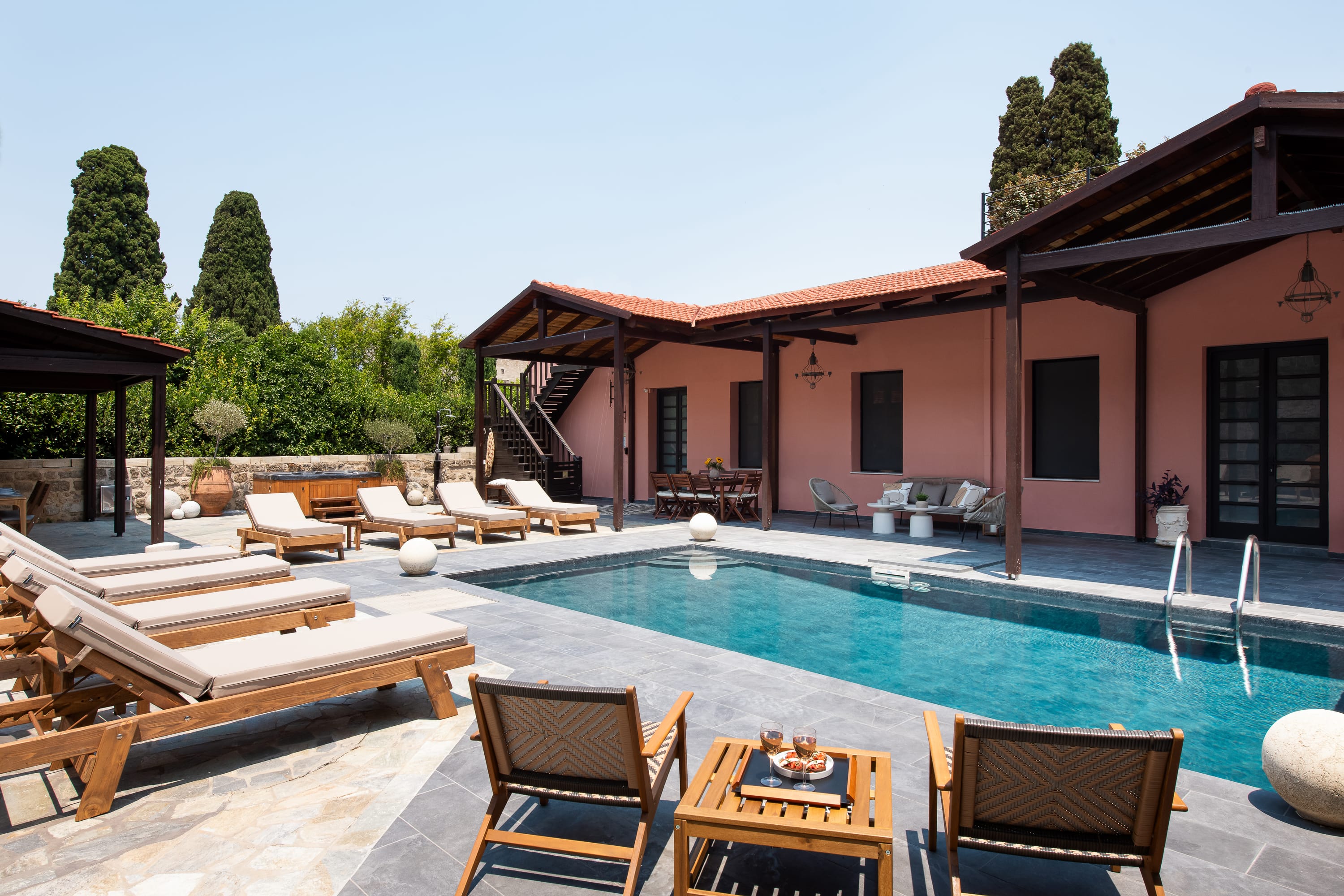 a swimming pool with chairs around it