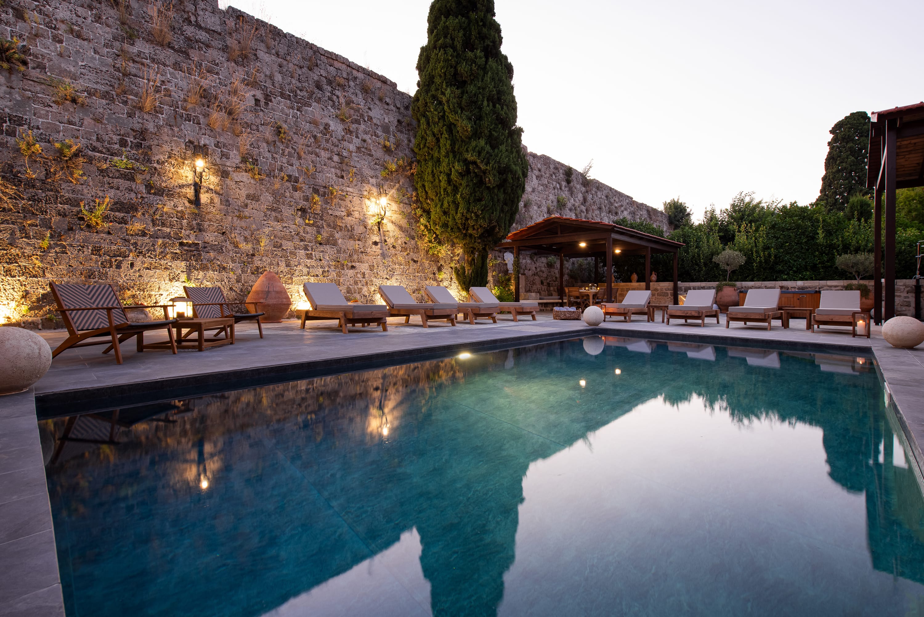 a pool with chairs around it