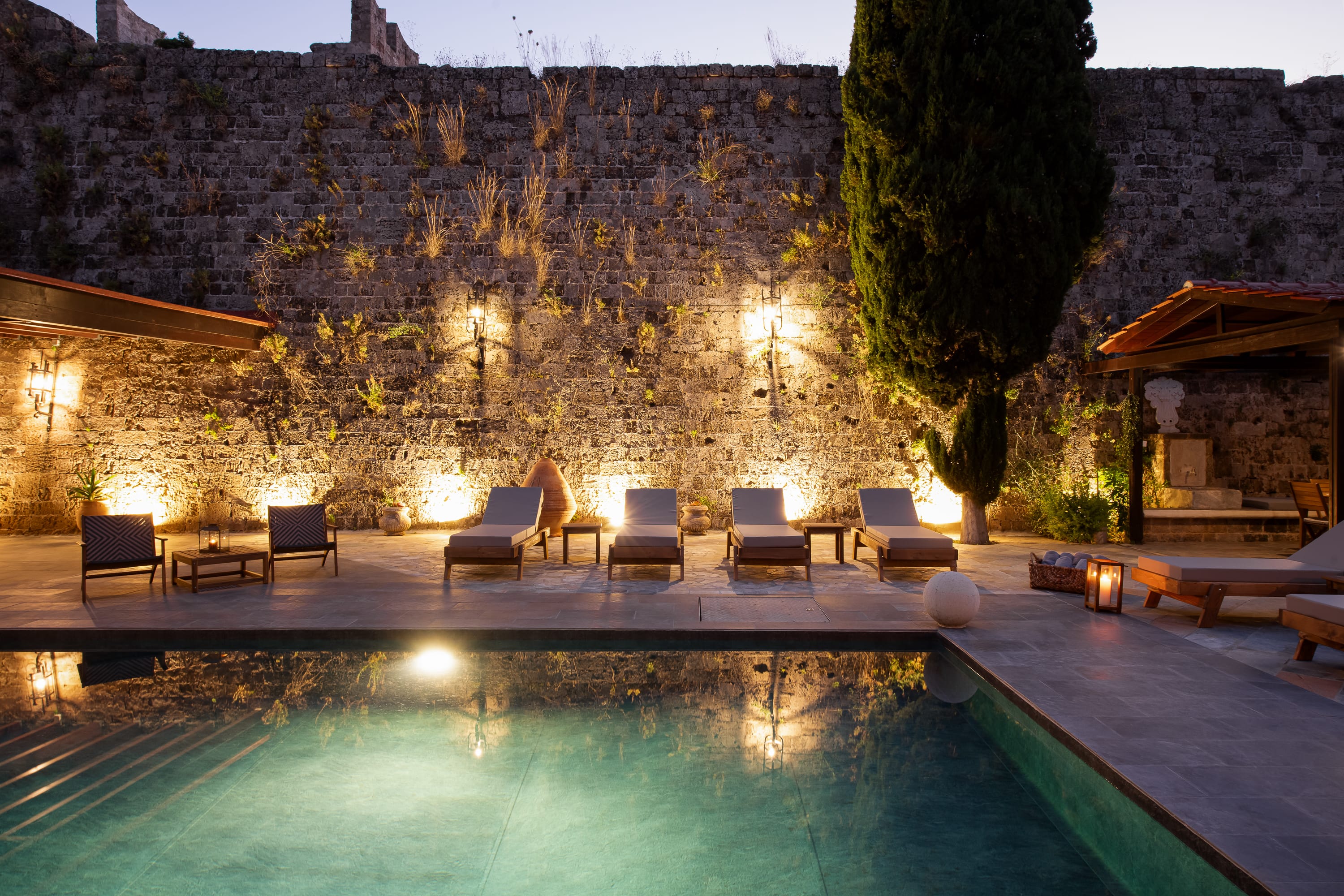 a pool with chairs around it