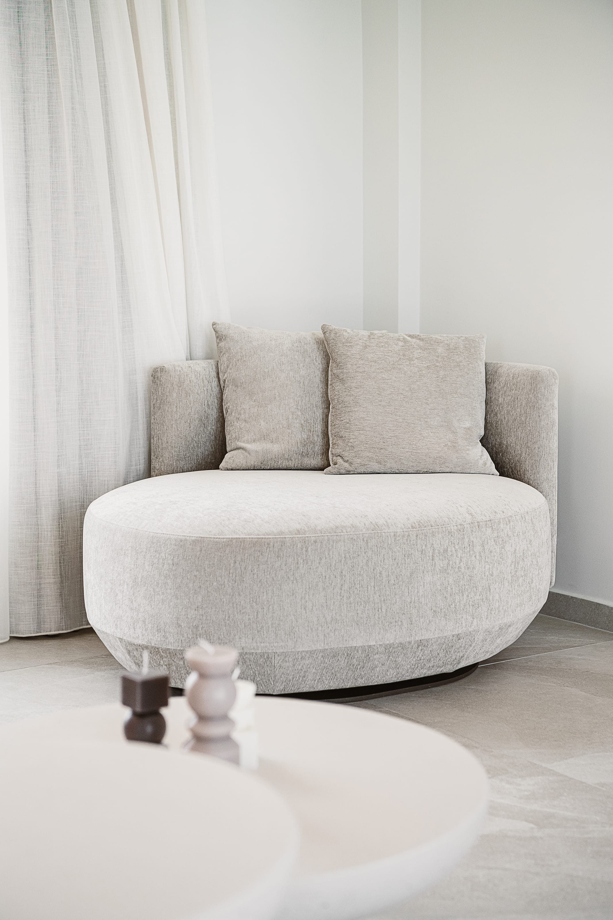 a white couch with pillows