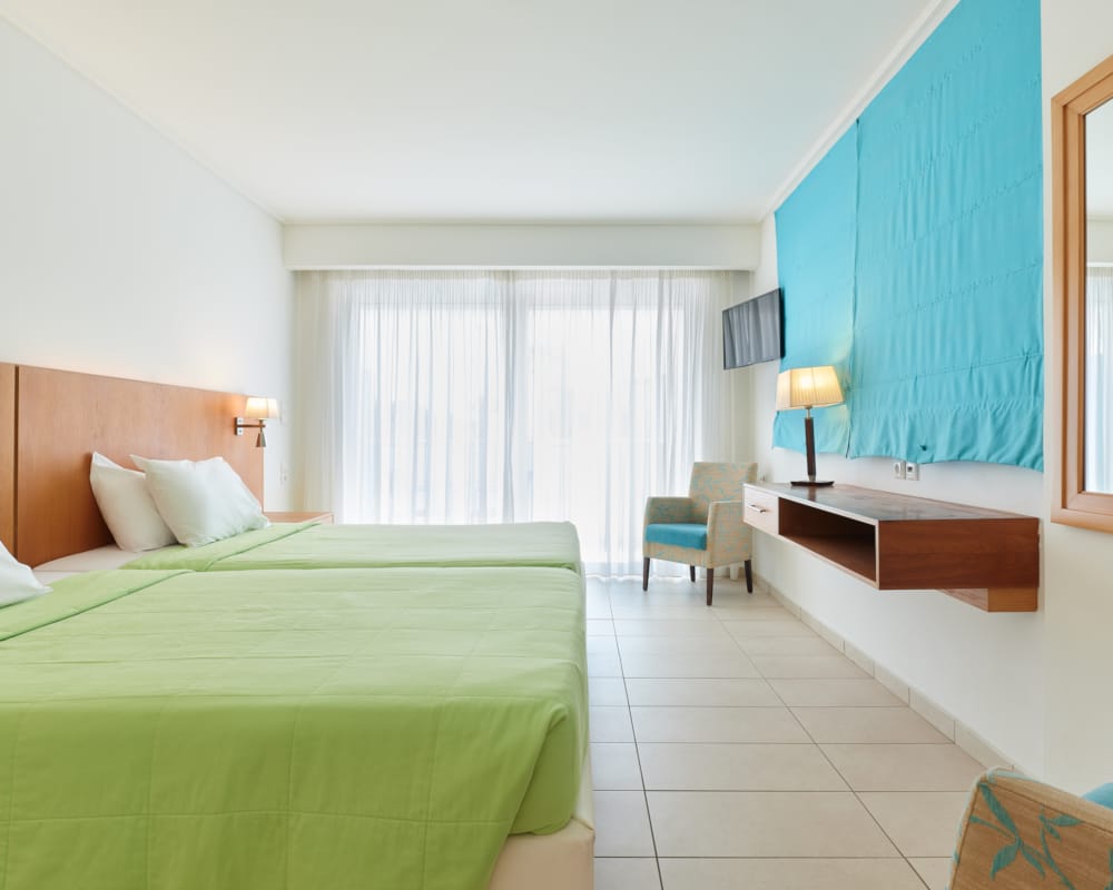 a bedroom with a bed and a desk