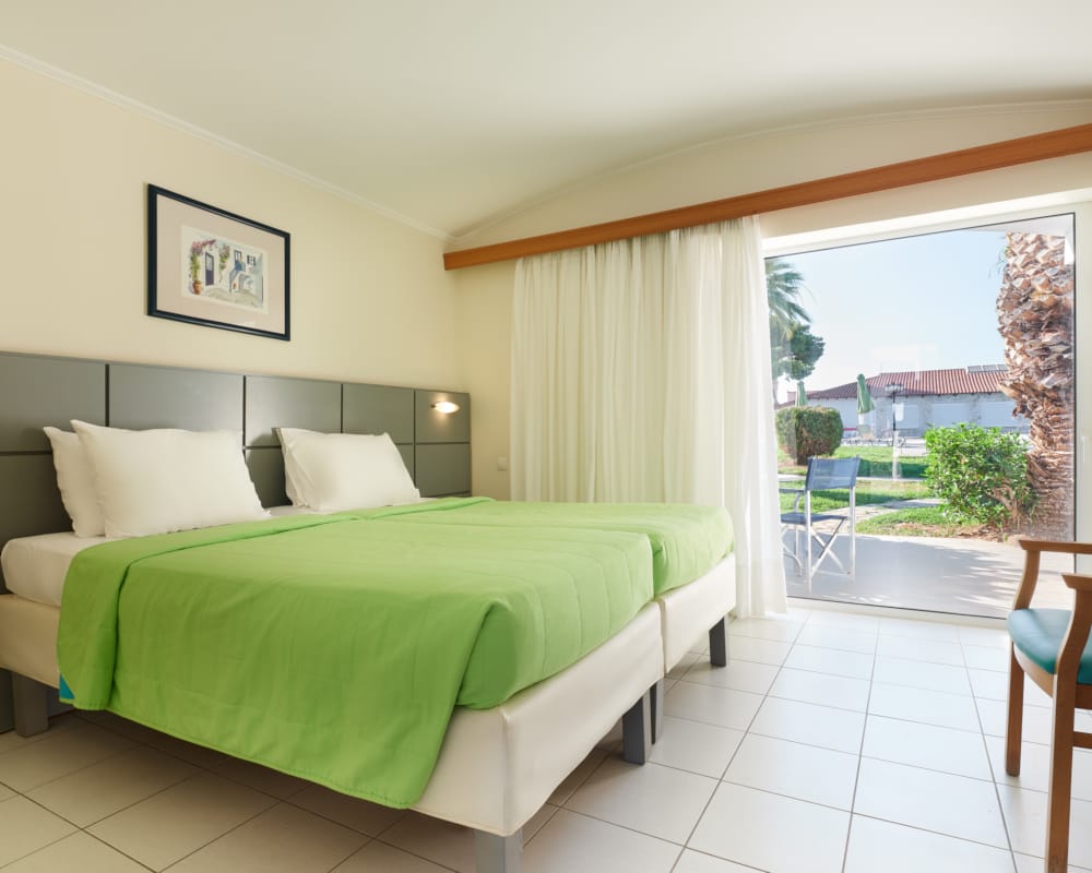 a bedroom with a large window