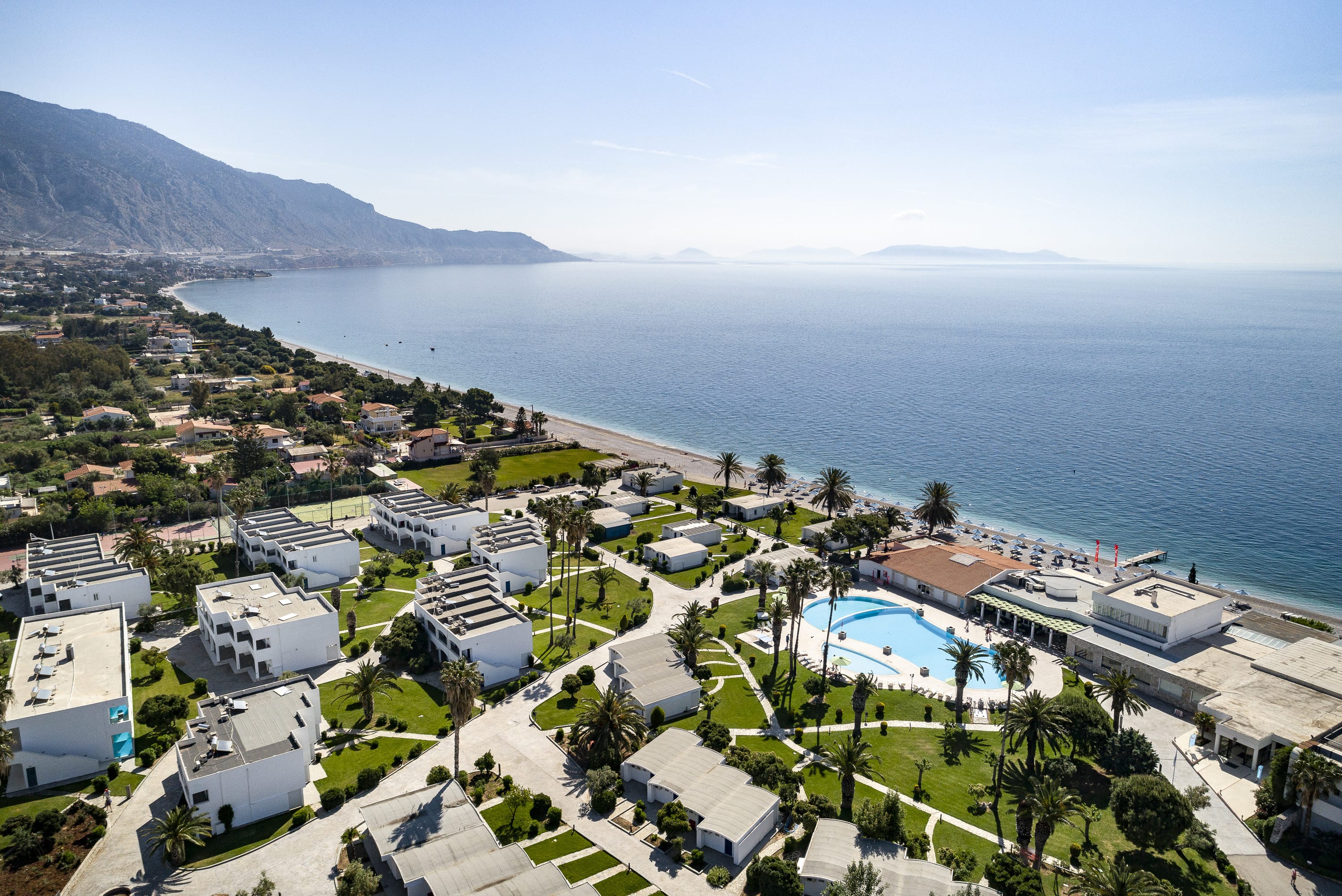 a high angle view of a town by the sea