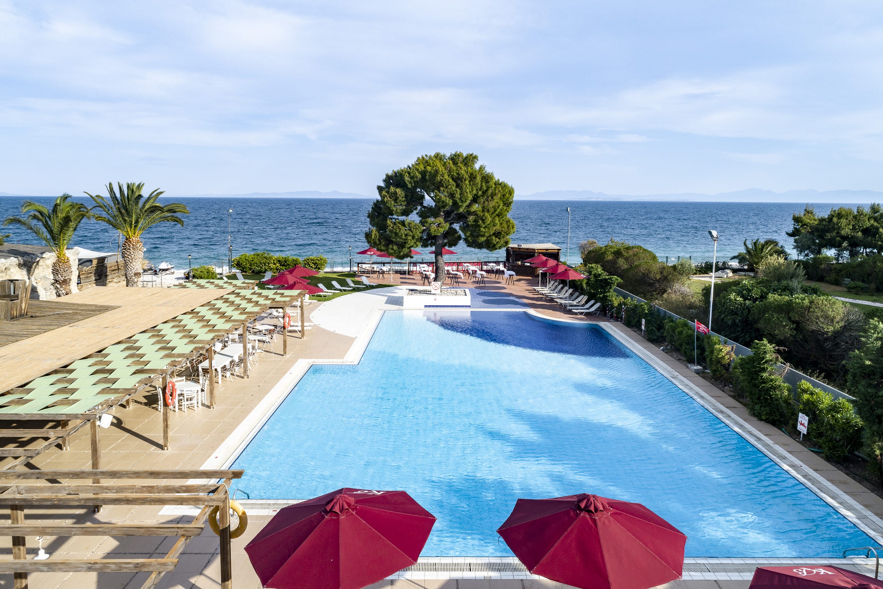 a pool with umbrellas by it