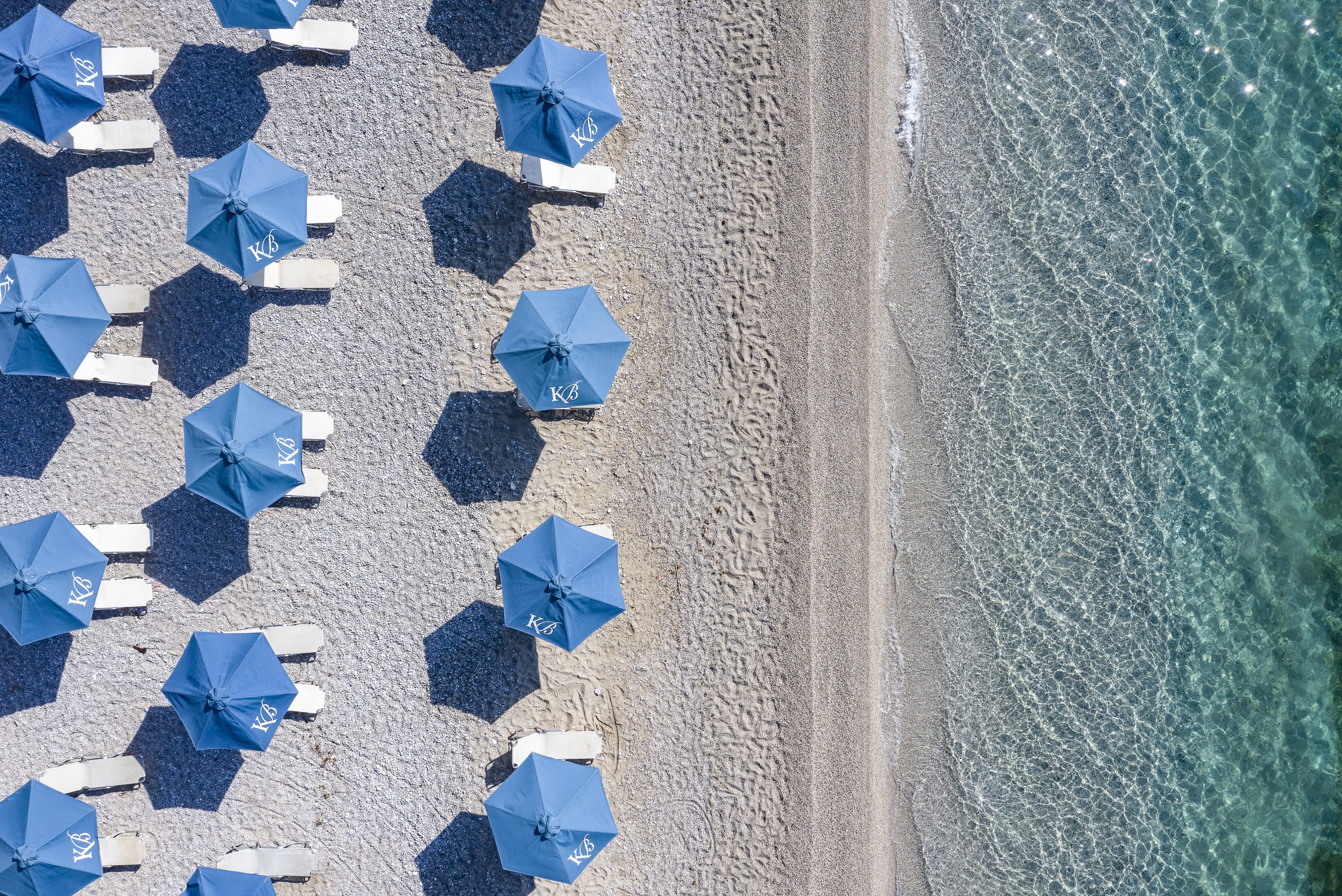 a group of blue chairs on a field
