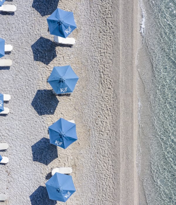 a group of blue chairs on a field