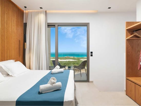 a bedroom with a large window