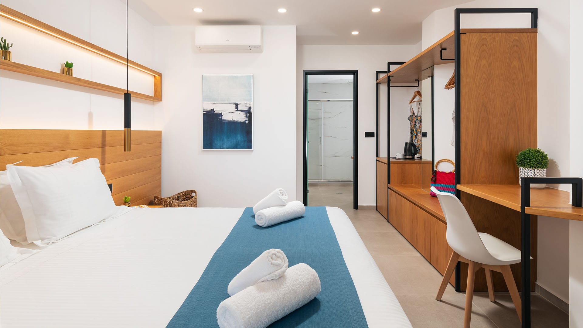 a room with a bed and a desk