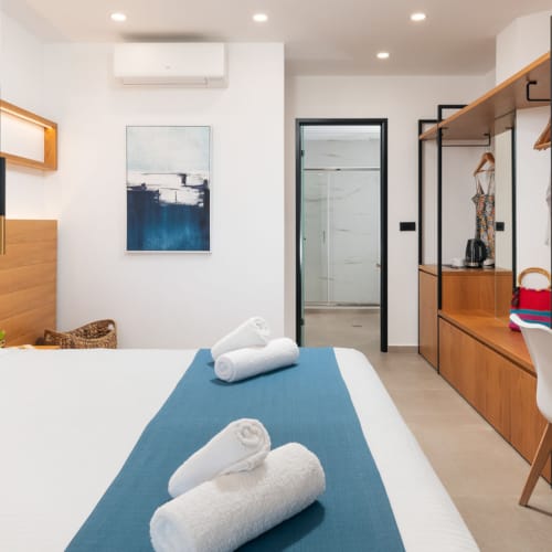 a room with a bed and a desk