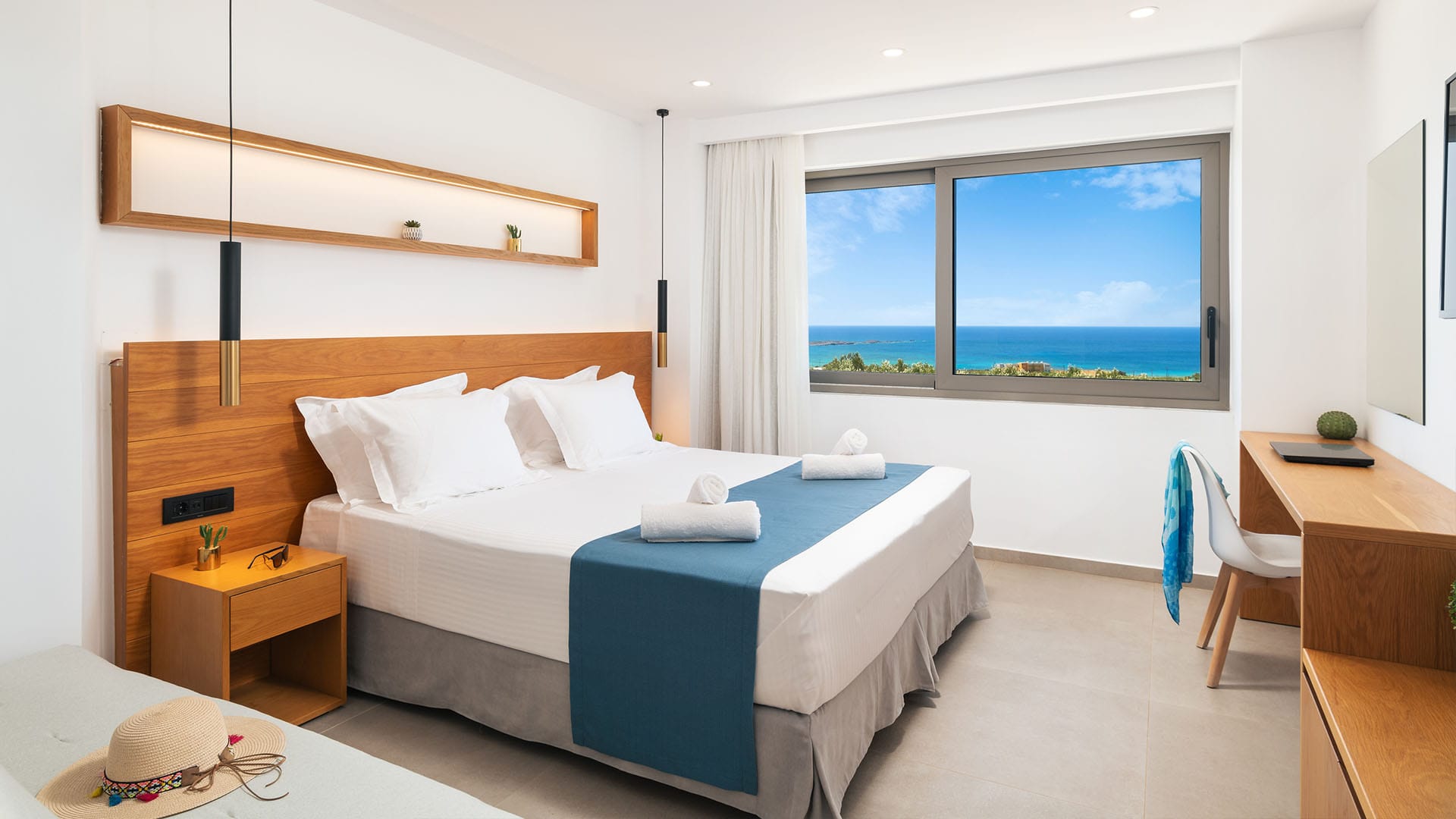 a bedroom with a bed and a desk