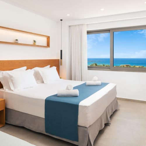 a bedroom with a bed and a desk