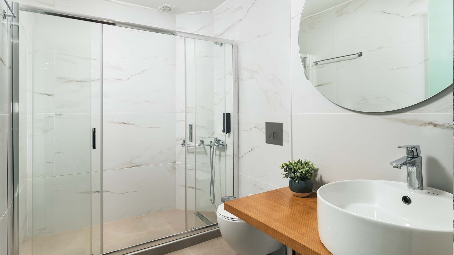 a bathroom with a glass shower