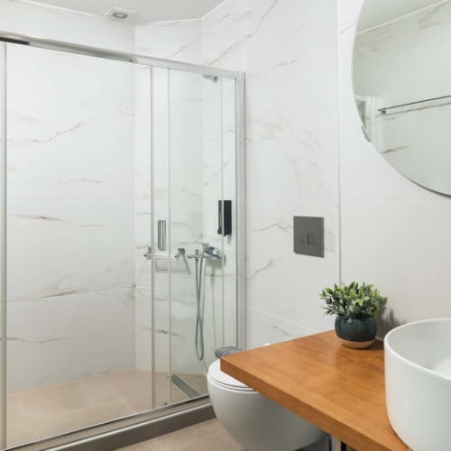 a bathroom with a glass shower
