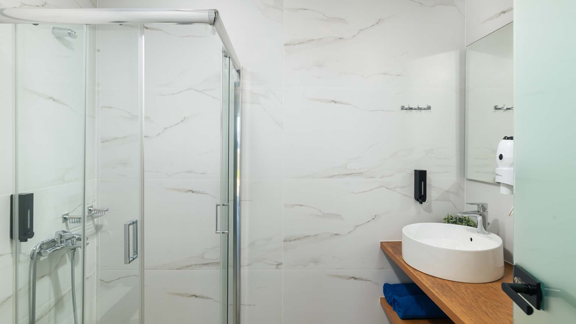 a bathroom with a sink and shower