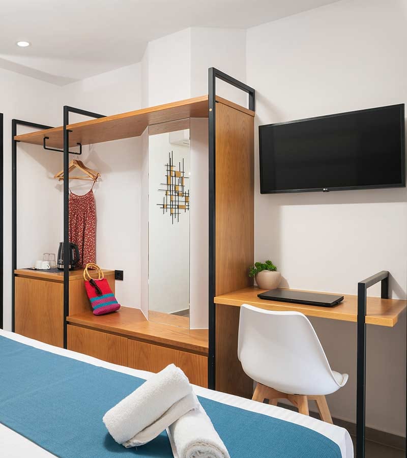 a room with a bed and a tv