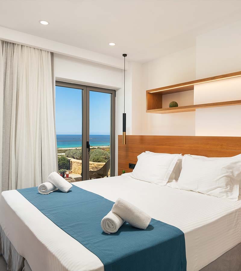 a bed with a blue comforter