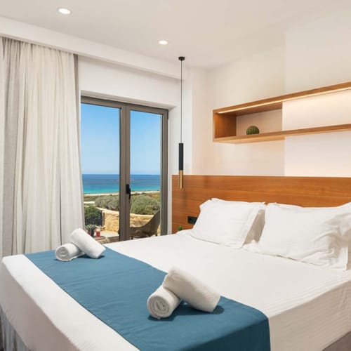 a bed with a blue comforter