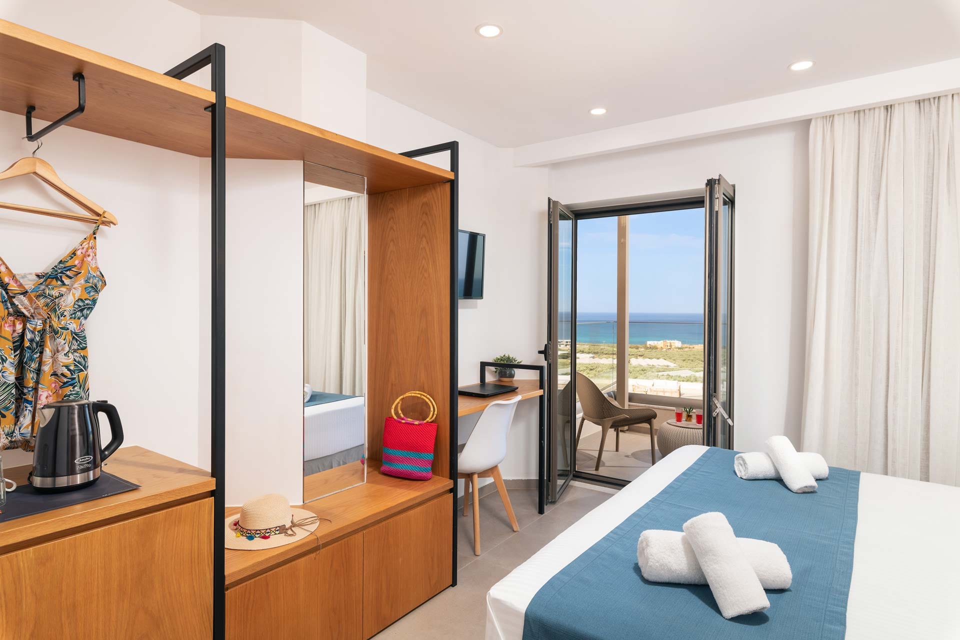 a bedroom with a bed and a mirror