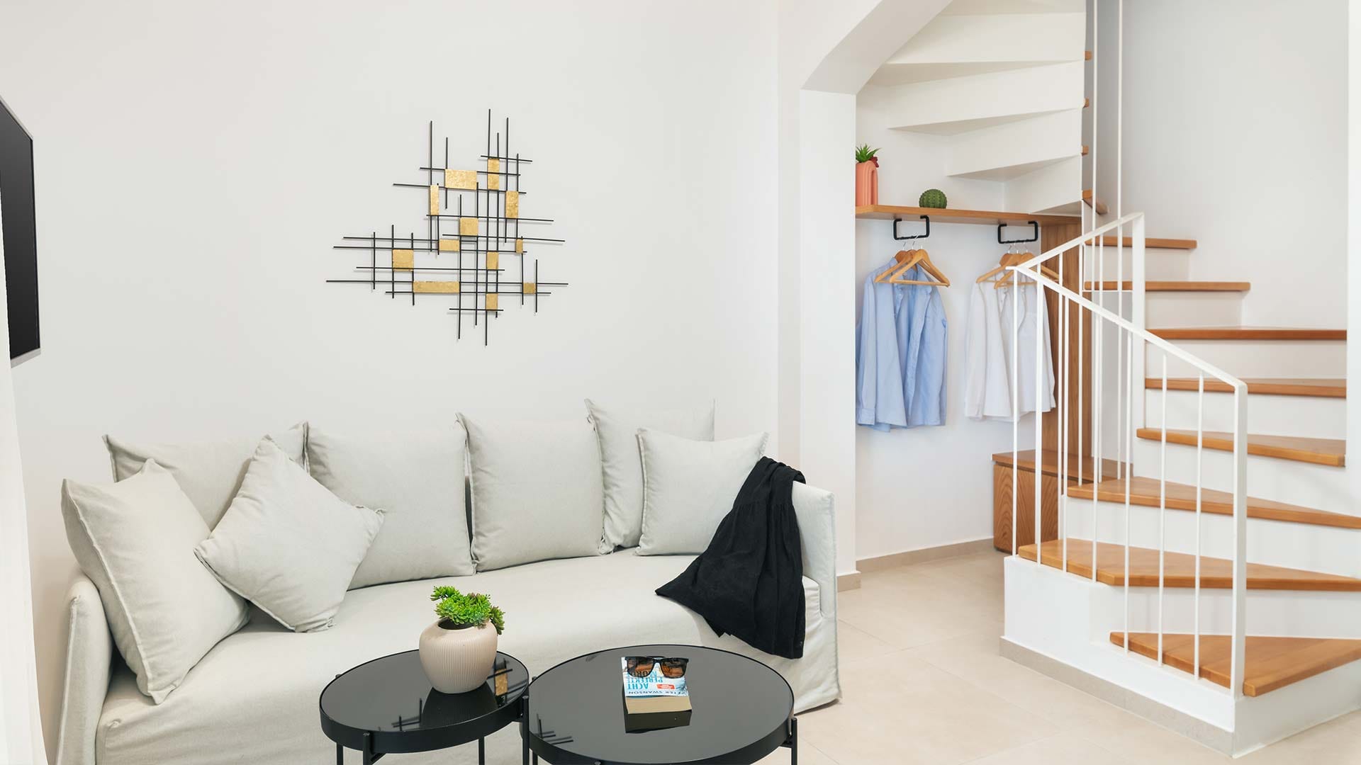 a room with a bed and a table with a lamp on it