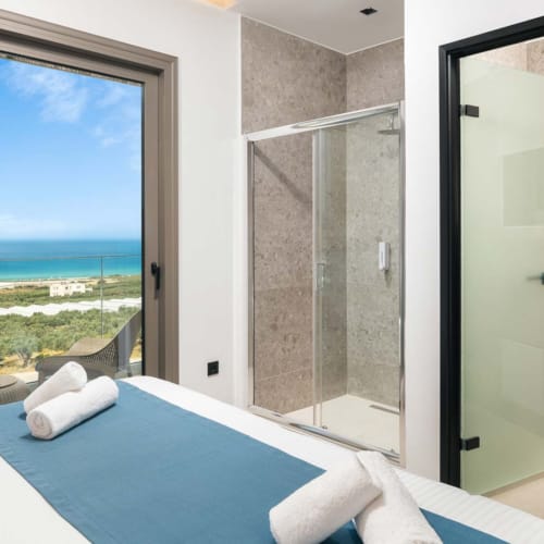 a bathroom with a large glass door