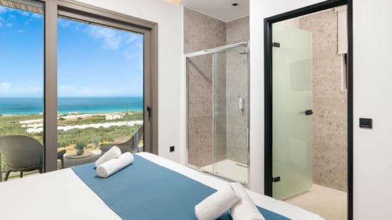 a bathroom with a large glass door
