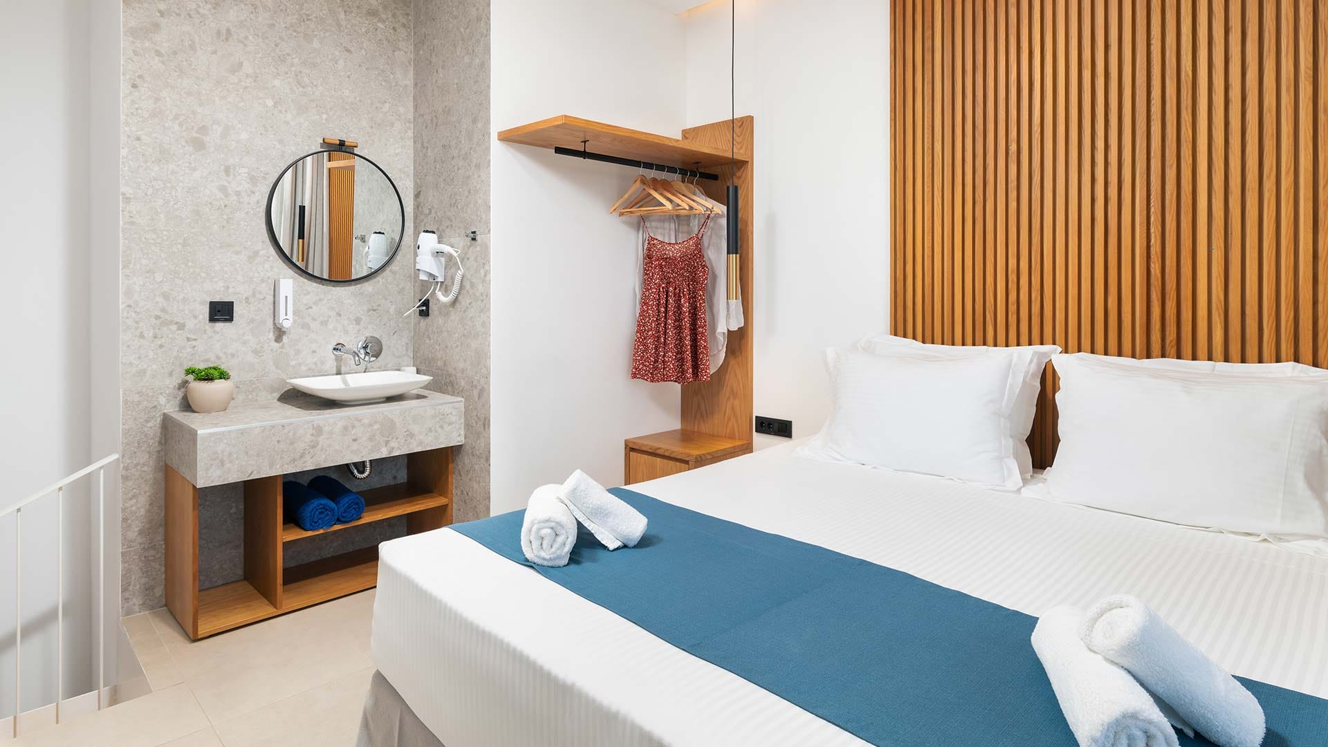 a bathroom with a bed and a sink
