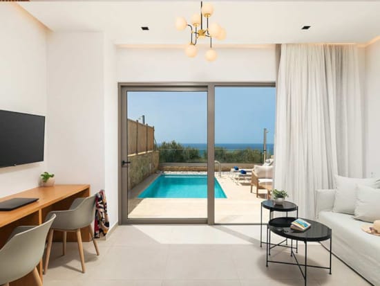 a room with a pool and a large window