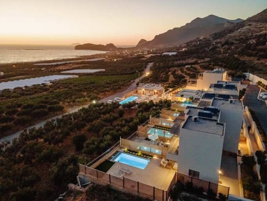 a group of buildings by a beach