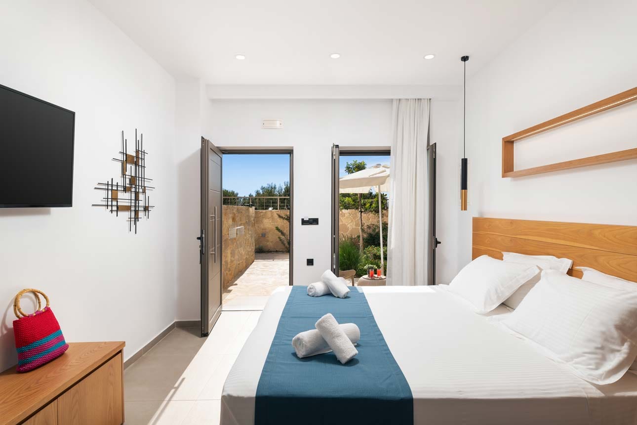 a bedroom with a large window