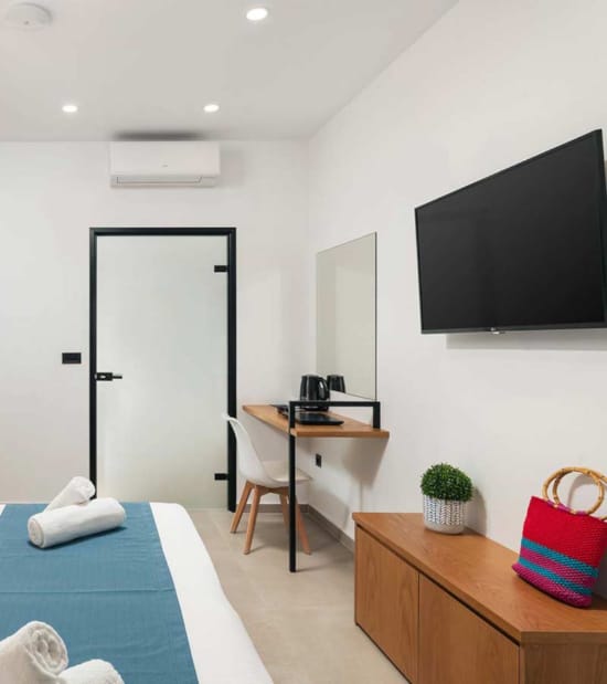 a room with a tv and a bed