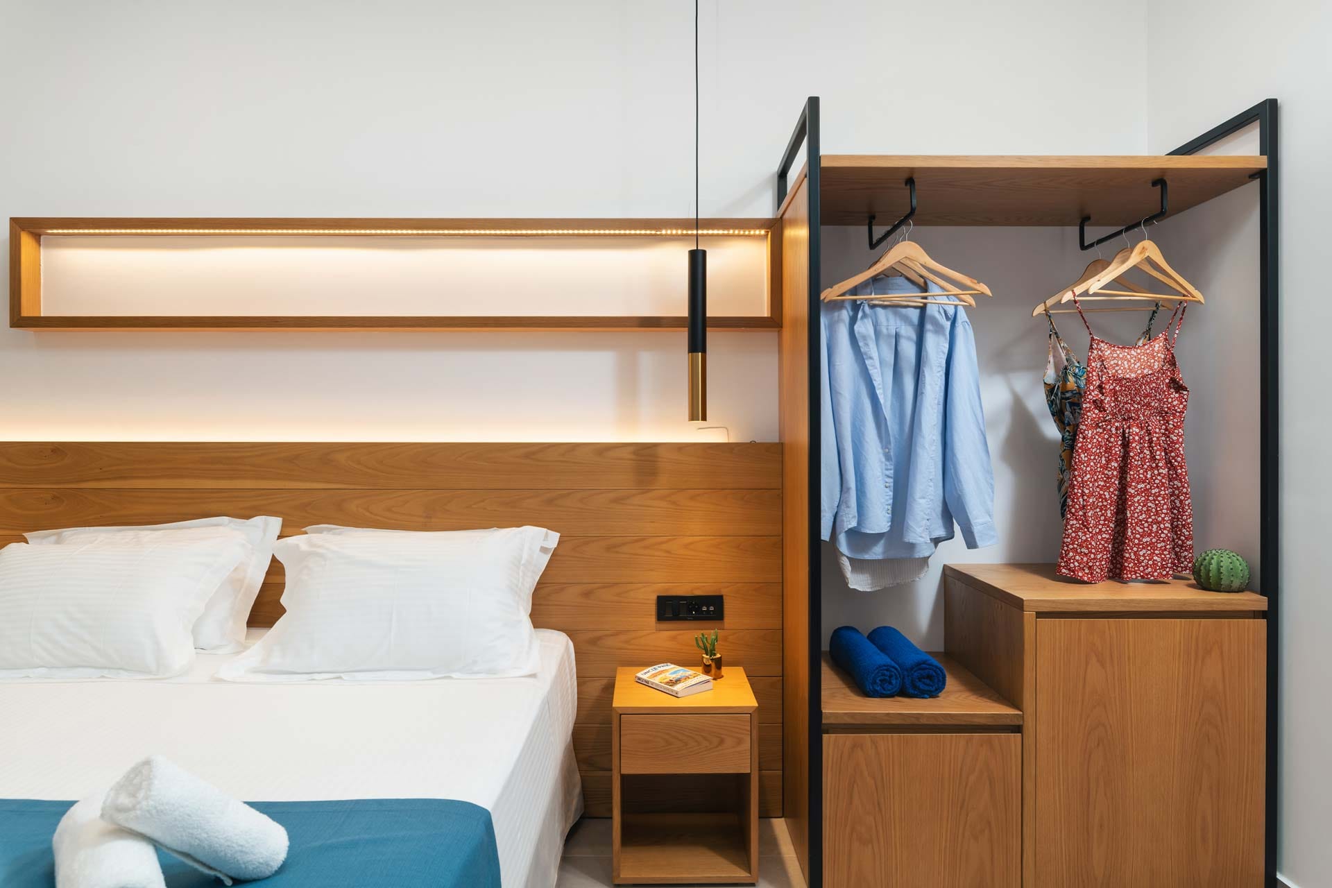 a bedroom with a bed and a mirror