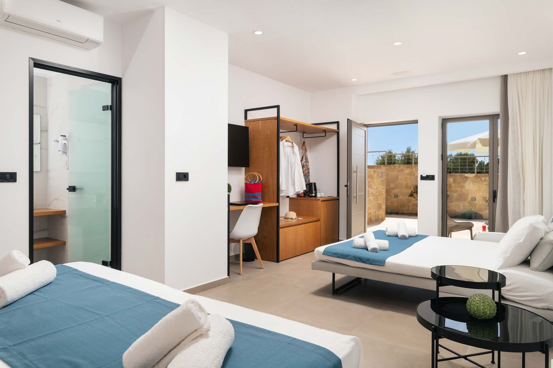 a room with a bed and a tv