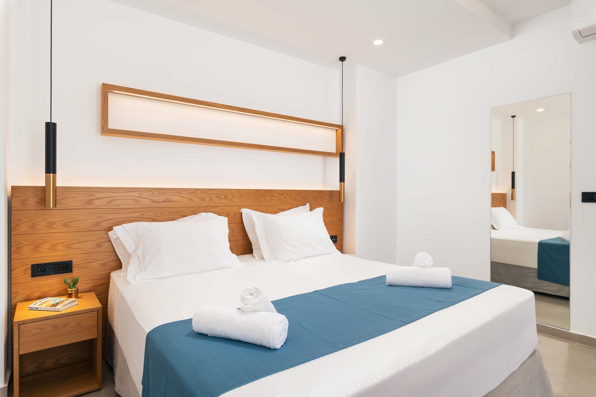 a bed with a blue cover