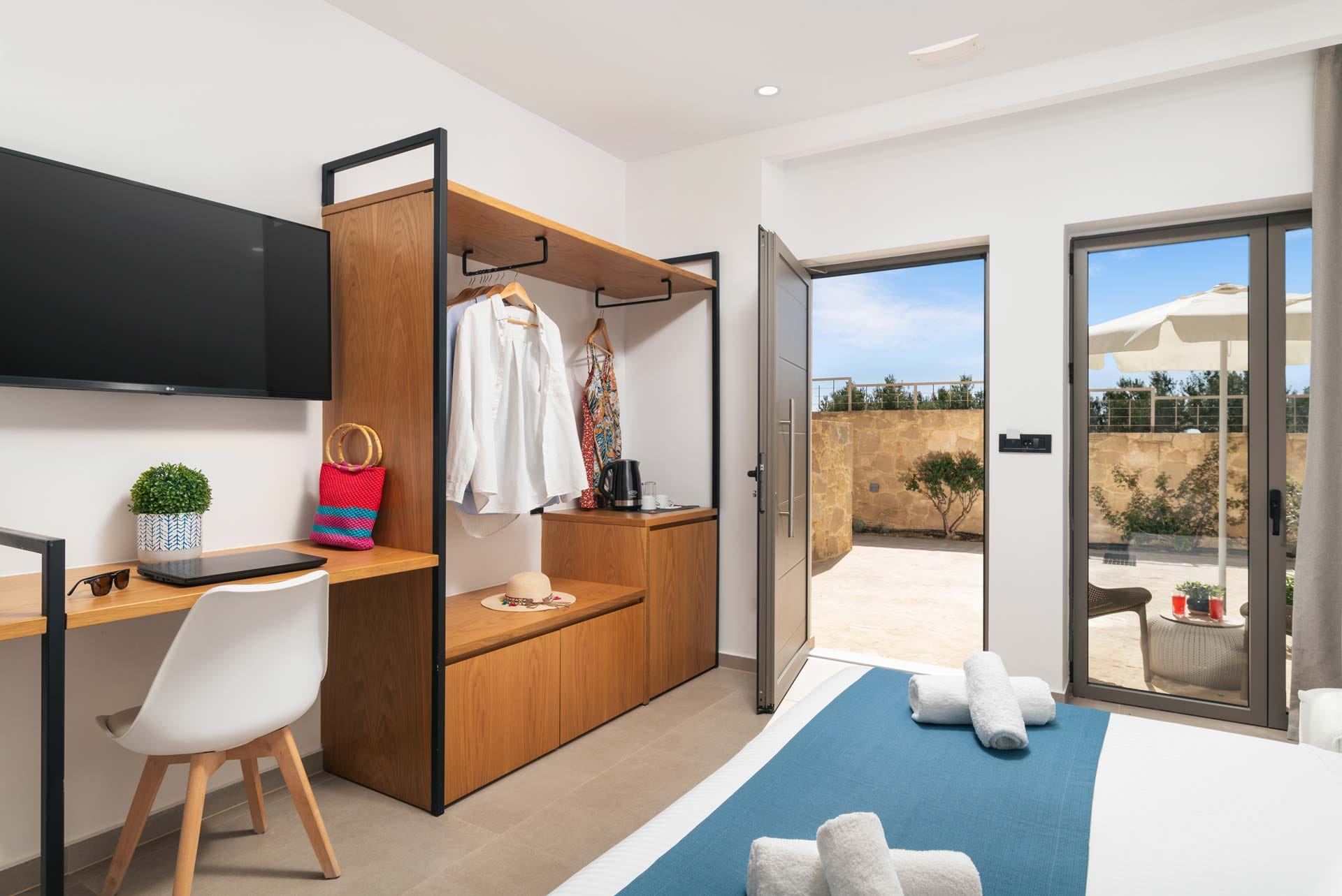 a room with a desk and a tv