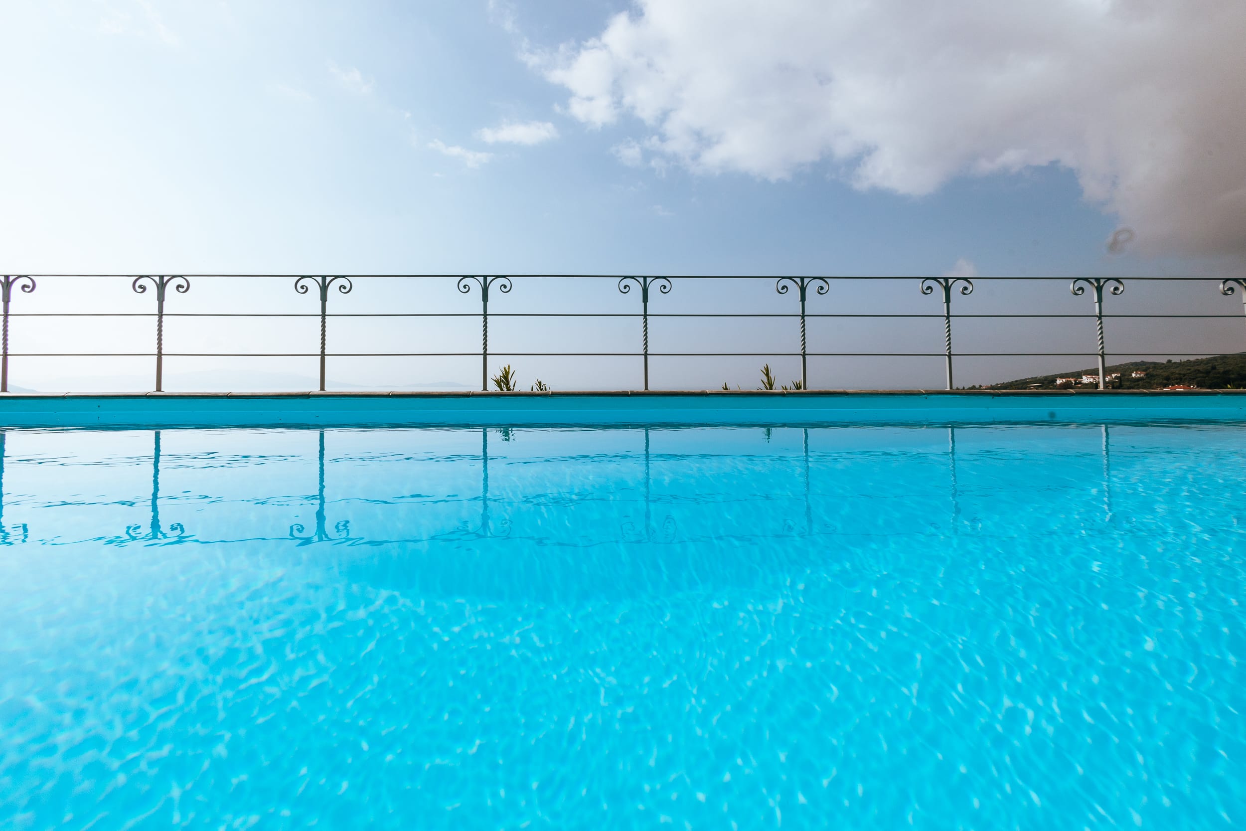 a swimming pool with a fence around it