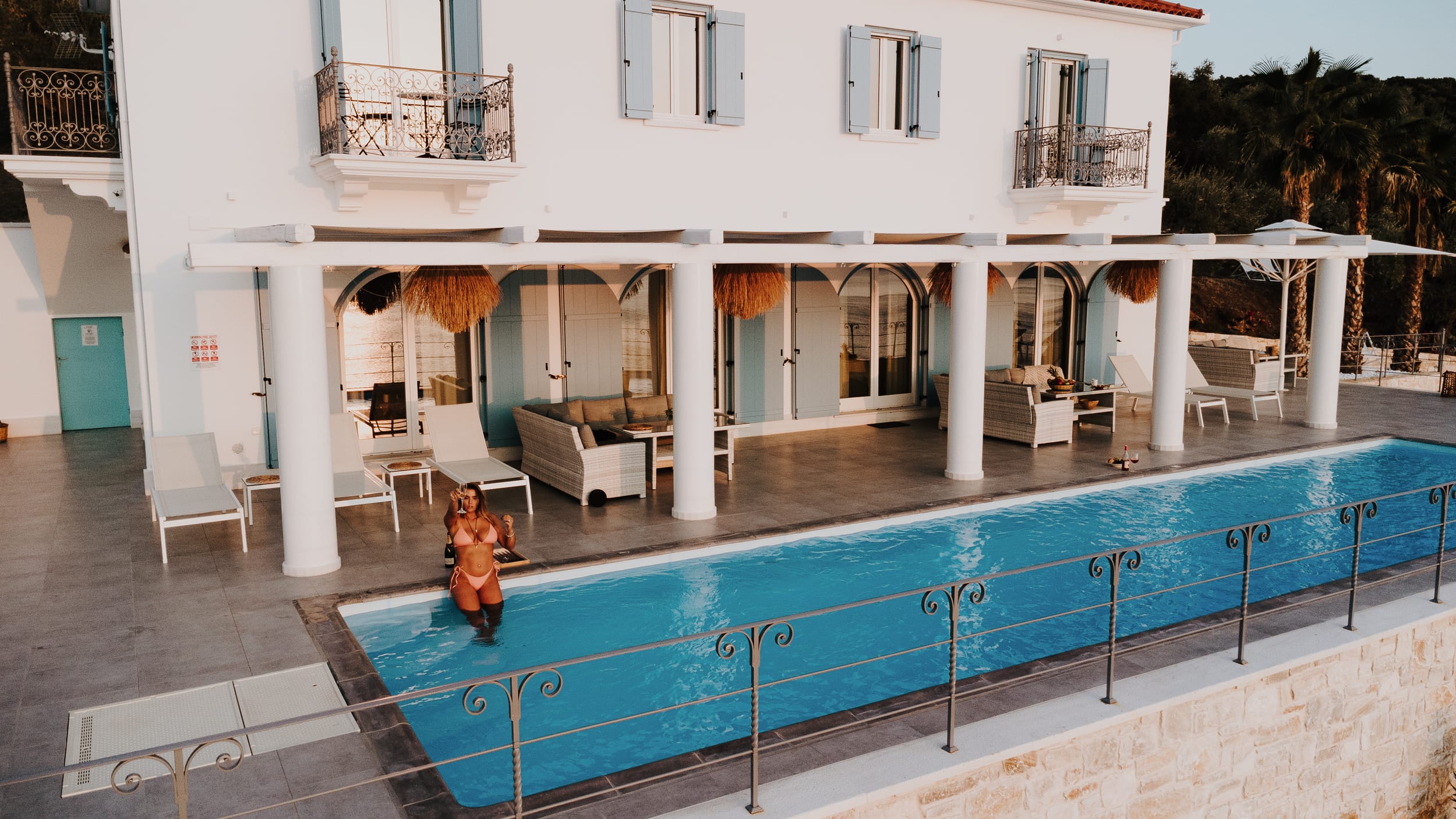 a swimming pool in front of a house
