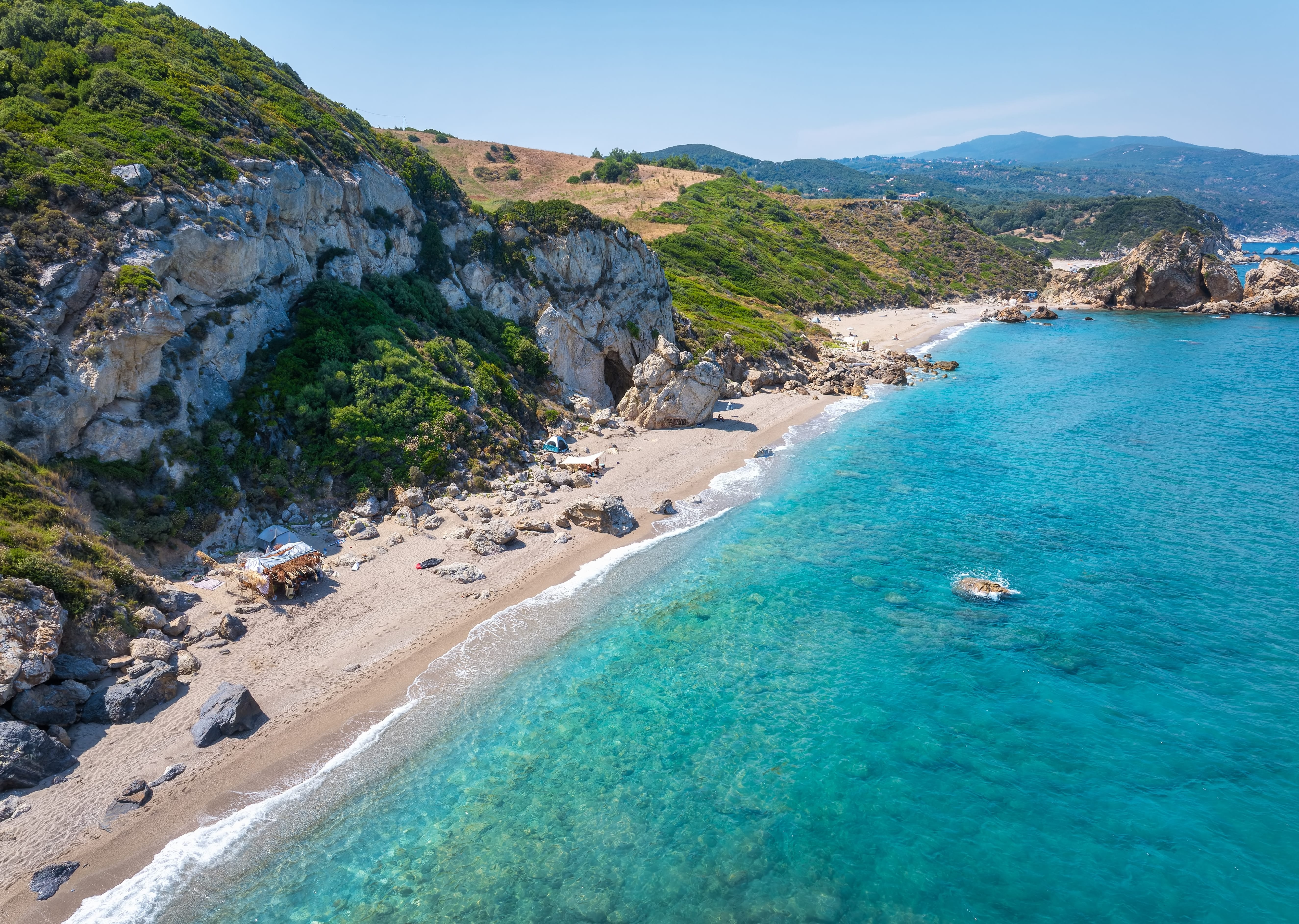 a beach with a body of water