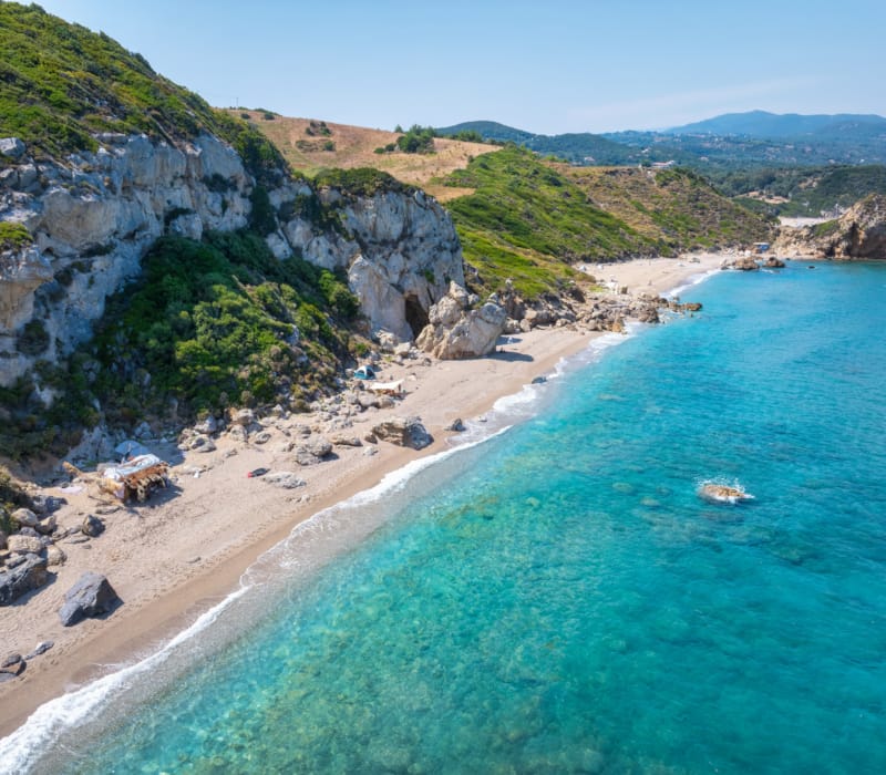 a beach with a body of water