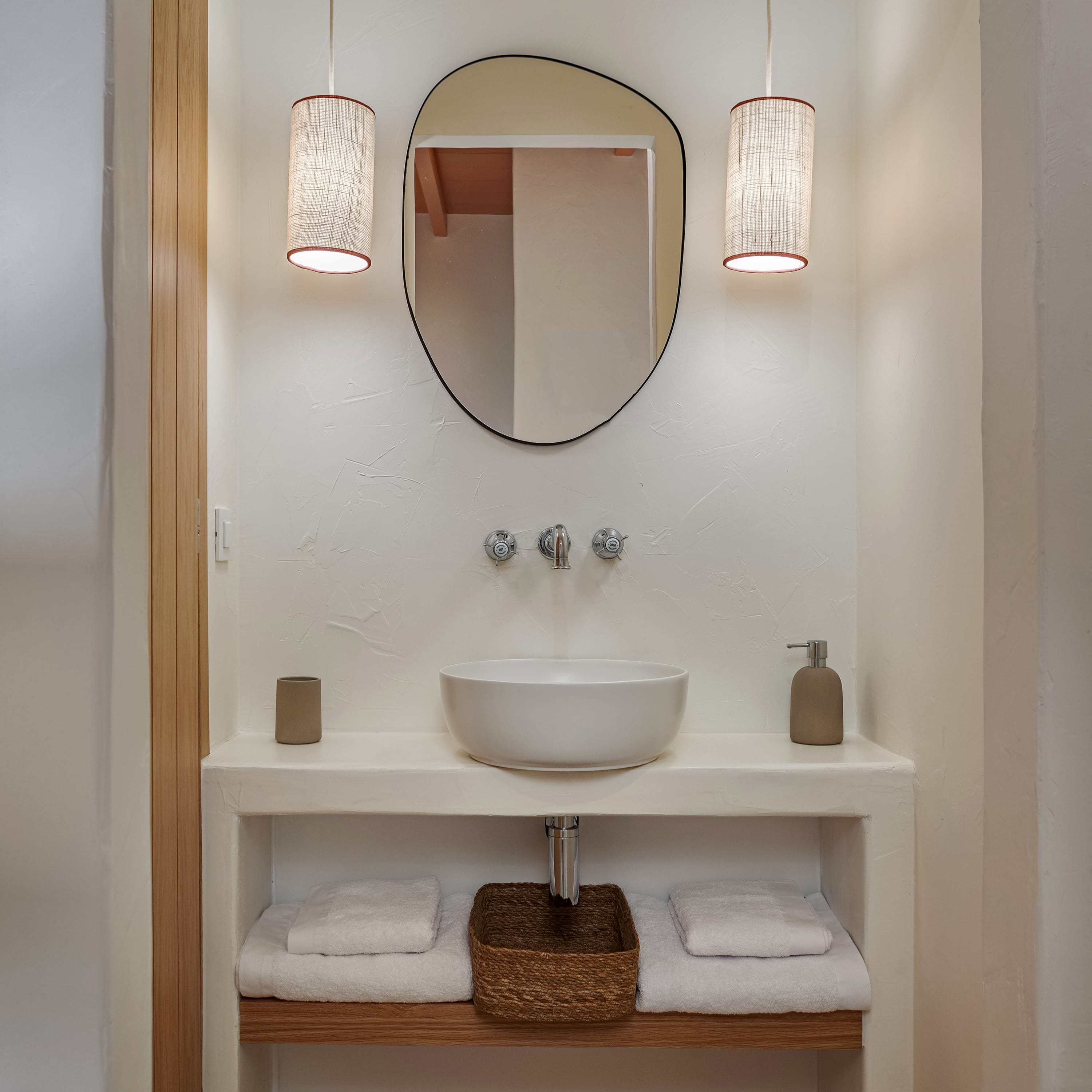 a bathroom with a mirror and a sink