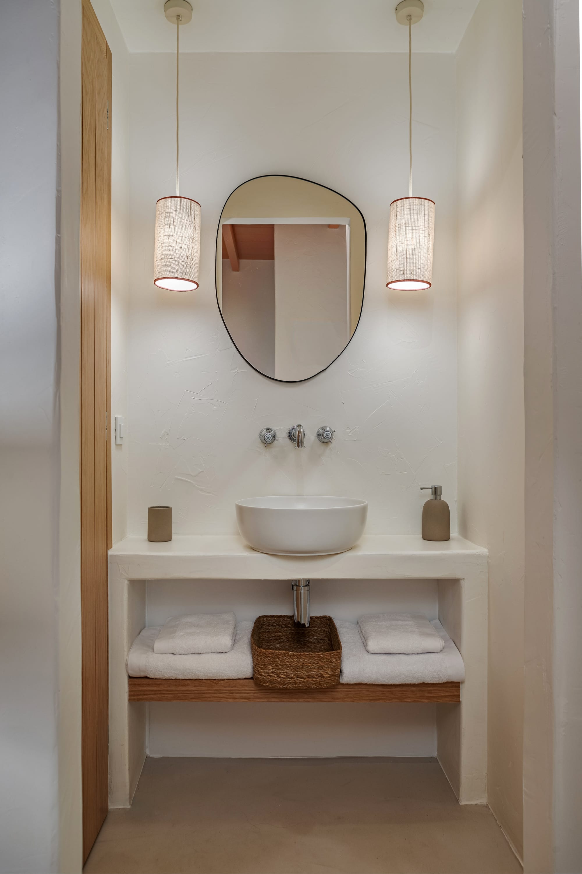 a bathroom with a mirror and a sink