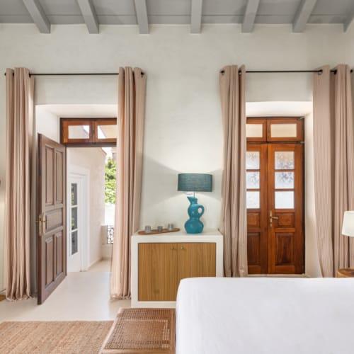 a bedroom with a bed and a desk