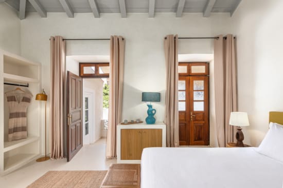 a bedroom with a bed and a desk