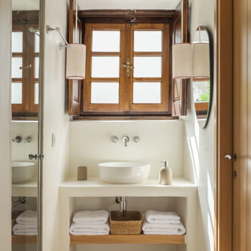 a bathroom with a sink and a mirror